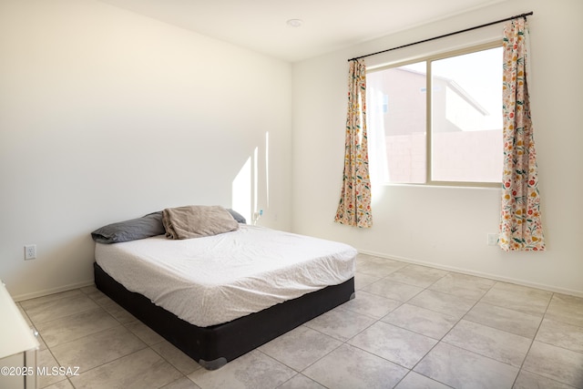 bedroom featuring light tile patterned floors