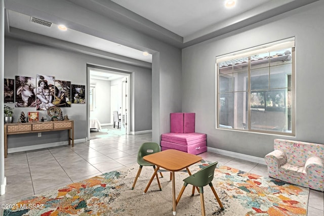 living area featuring light tile patterned floors