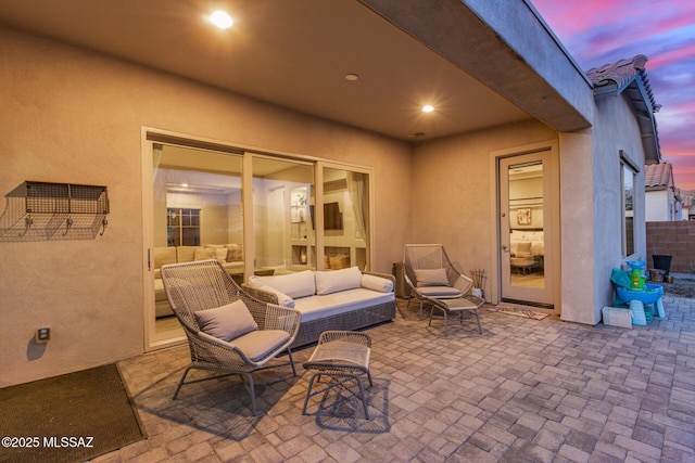 patio terrace at dusk with an outdoor hangout area