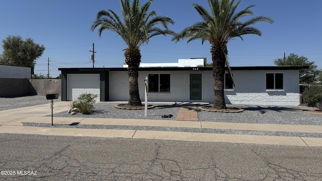 ranch-style home with a garage