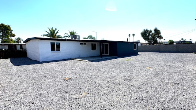 rear view of property featuring central AC and a patio