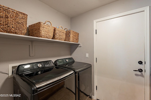 laundry area featuring tile patterned flooring and washer and clothes dryer