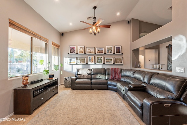 living room with lofted ceiling, light tile patterned floors, and ceiling fan