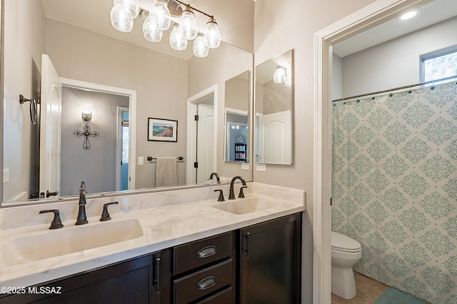 bathroom featuring vanity, a shower with curtain, and toilet