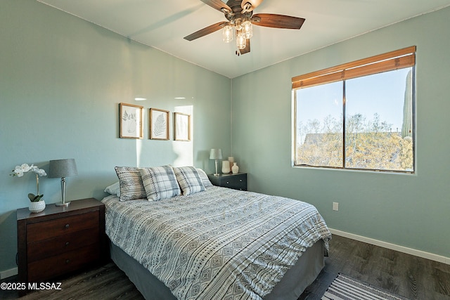 bedroom featuring ceiling fan and dark hardwood / wood-style floors