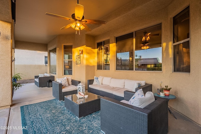 view of patio with ceiling fan and an outdoor living space