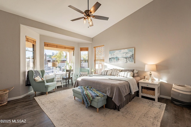 bedroom with ceiling fan, dark wood-type flooring, and high vaulted ceiling