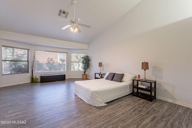 bedroom with ceiling fan, dark wood-type flooring, and high vaulted ceiling