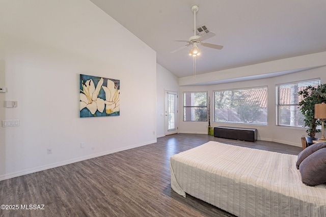 bedroom with ceiling fan, dark hardwood / wood-style flooring, multiple windows, and high vaulted ceiling