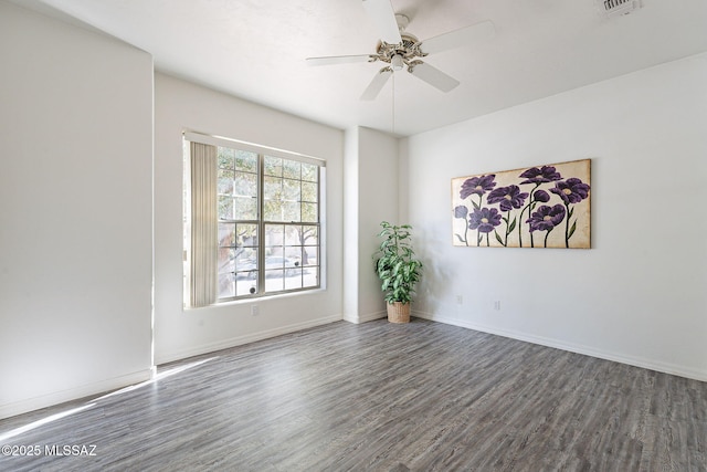 unfurnished room featuring ceiling fan and dark hardwood / wood-style flooring