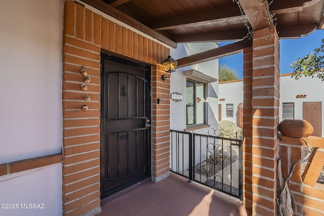 property entrance with brick siding
