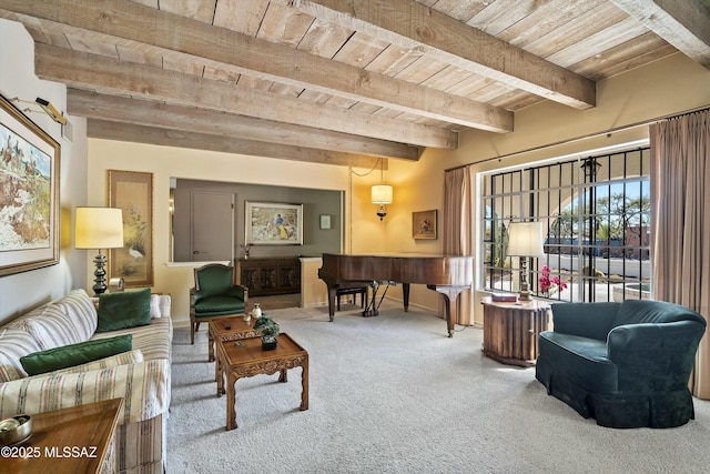 interior space featuring beam ceiling, wooden ceiling, and carpet flooring