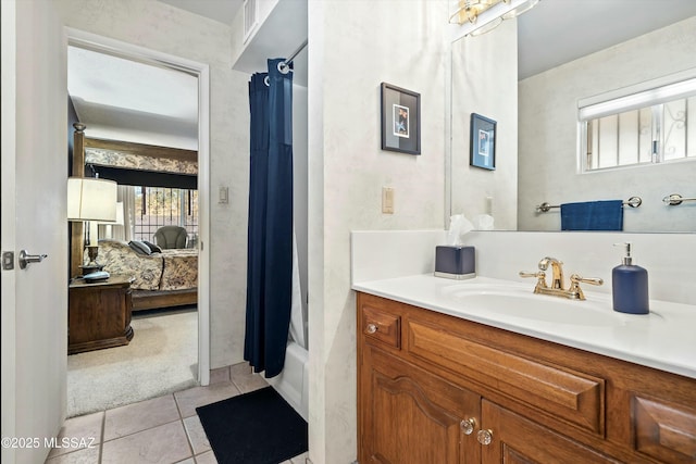 bathroom with tile patterned flooring, shower / bath combo, and vanity