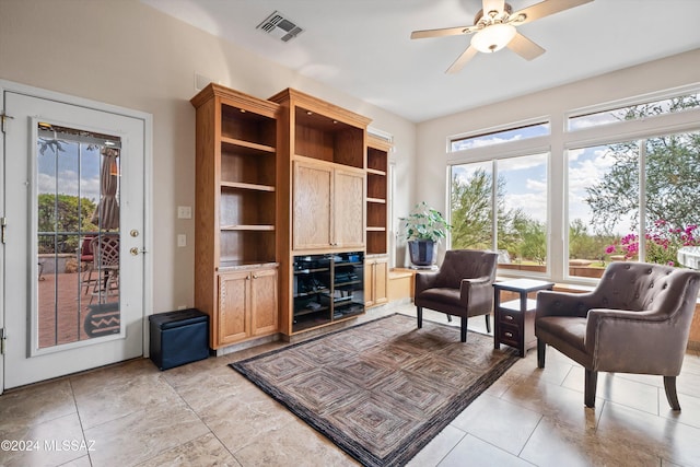 living area featuring ceiling fan