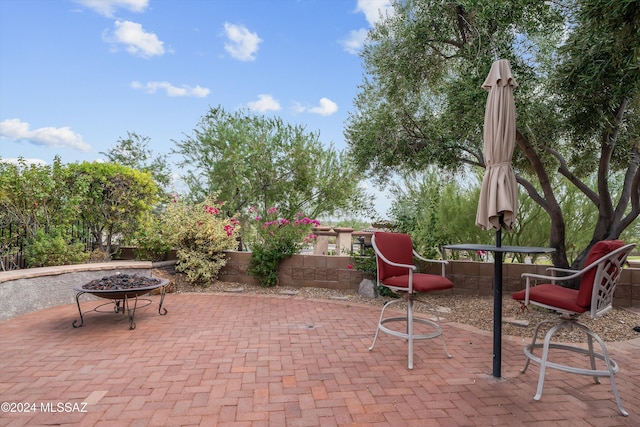 view of patio / terrace featuring a fire pit