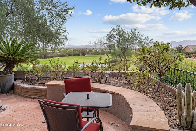 view of patio / terrace featuring a mountain view