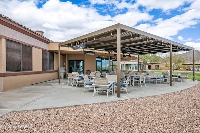 view of patio / terrace featuring ceiling fan