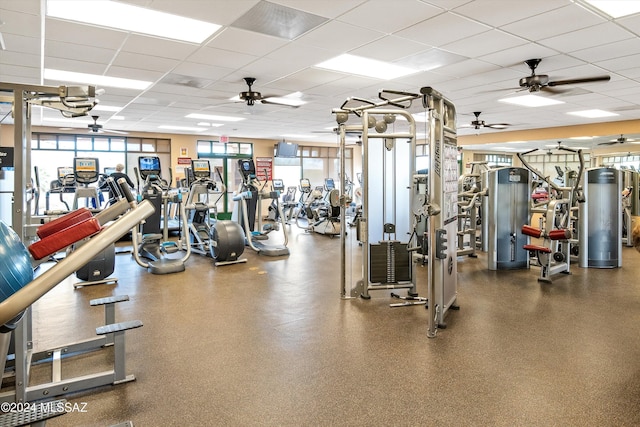 gym with a paneled ceiling