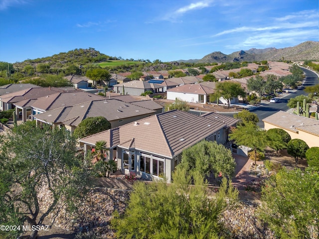 birds eye view of property with a mountain view