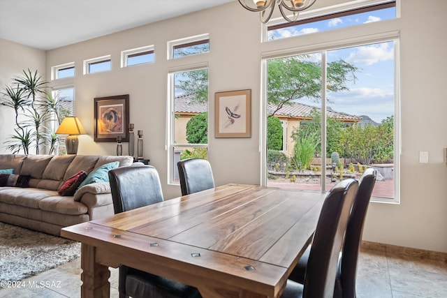 dining space with a chandelier