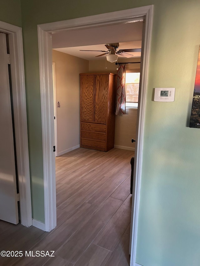 hall with hardwood / wood-style flooring