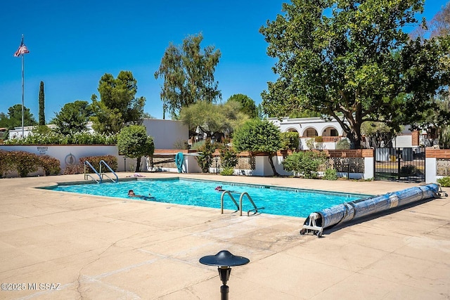 view of swimming pool featuring a patio