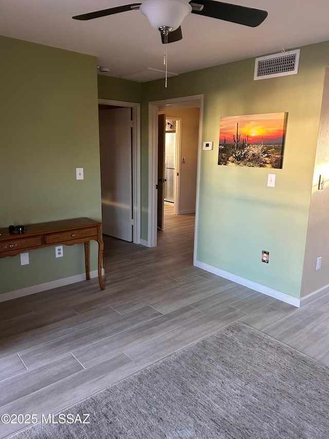 spare room featuring ceiling fan