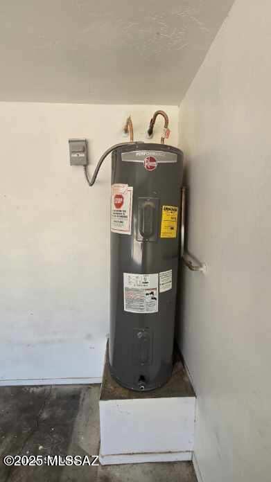 utility room with water heater