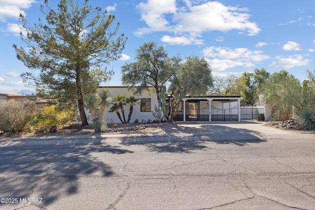 view of front of house featuring a carport