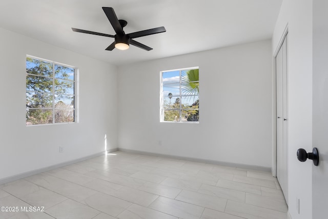 spare room with ceiling fan