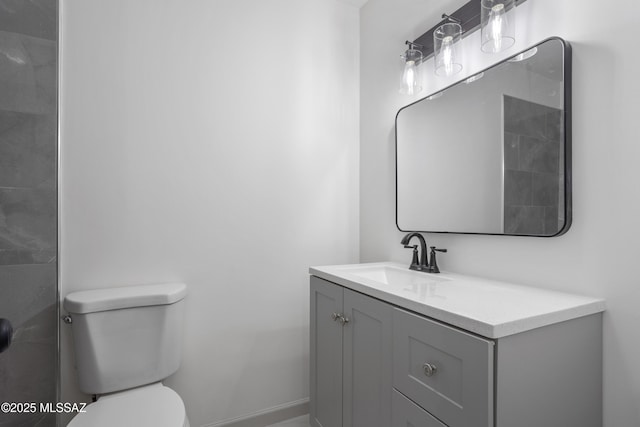 bathroom featuring toilet and vanity