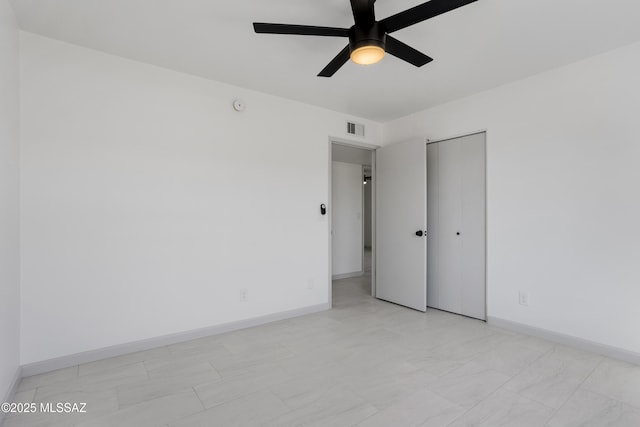 unfurnished room with ceiling fan