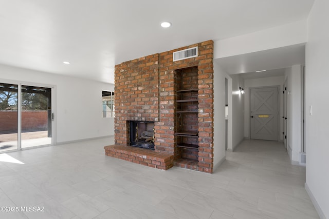 unfurnished living room with a fireplace