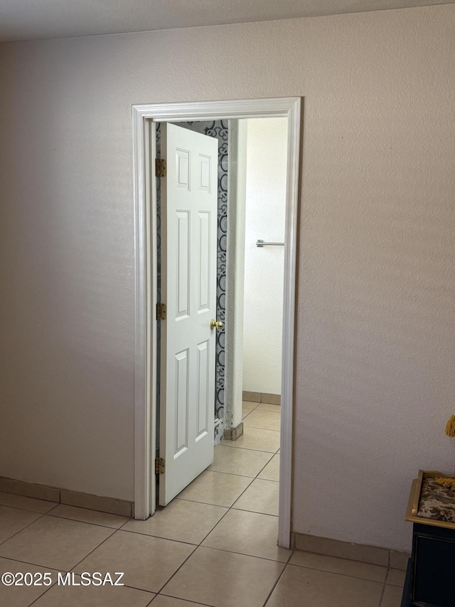 hallway with light tile patterned floors