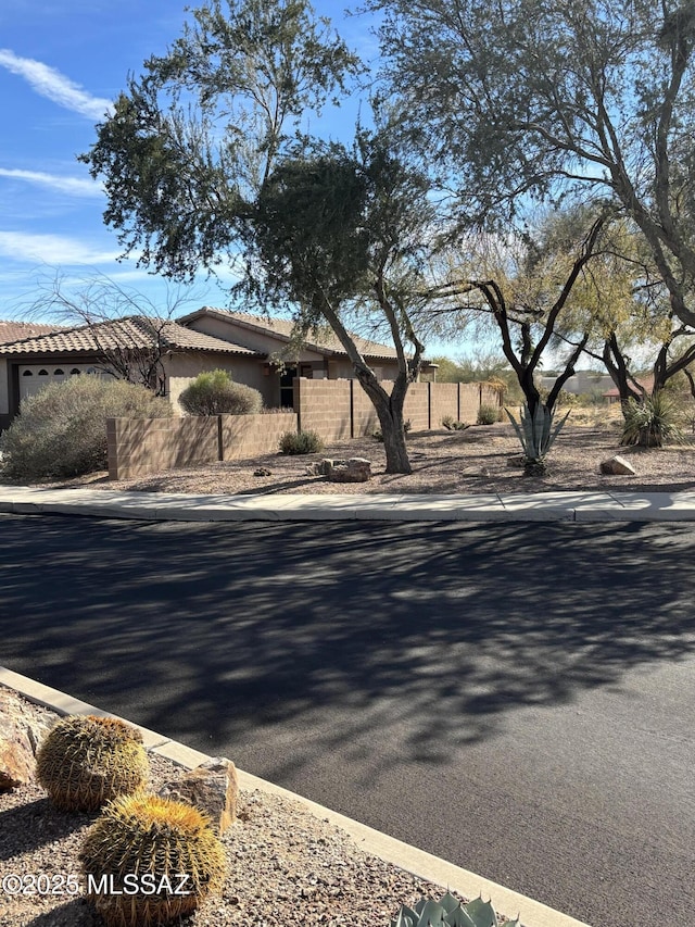 view of street featuring curbs