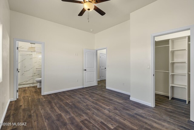 kitchen with stainless steel appliances, dark brown cabinetry, sink, and dark wood-type flooring