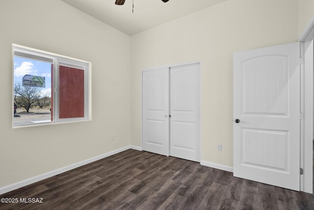 full bathroom featuring toilet, hardwood / wood-style flooring, enclosed tub / shower combo, and vanity