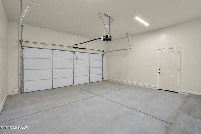 unfurnished bedroom with ensuite bathroom, a spacious closet, ceiling fan, a closet, and dark wood-type flooring