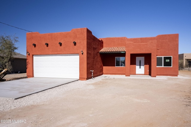 adobe home with a garage