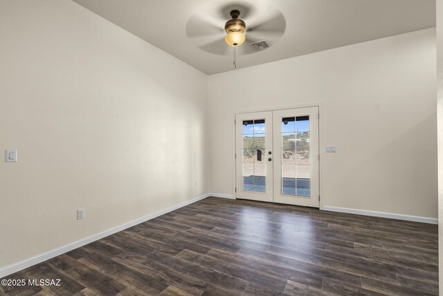 unfurnished room with ceiling fan, dark wood-type flooring, and french doors