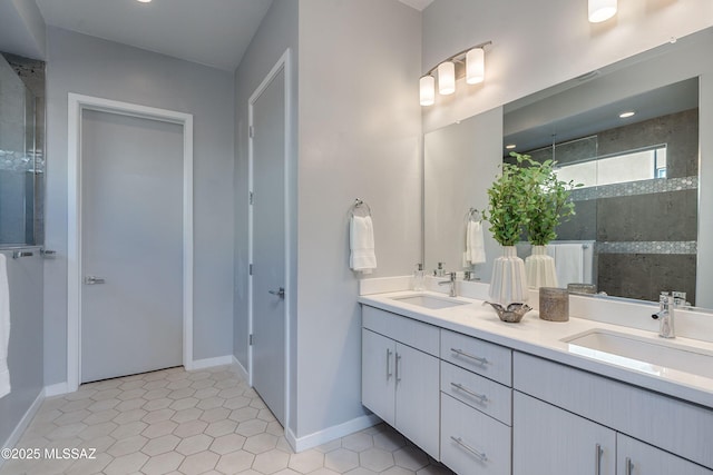 bathroom with tile patterned flooring, vanity, and a shower