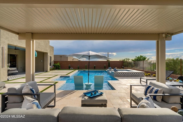 view of swimming pool featuring an in ground hot tub and a patio