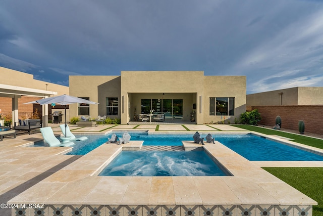 view of pool featuring an in ground hot tub and a patio area