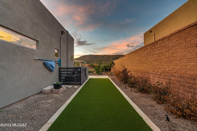 yard at dusk with a mountain view