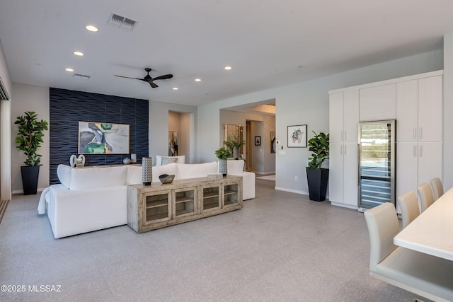 living room with beverage cooler and ceiling fan