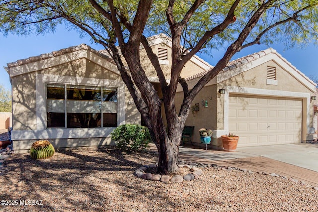 ranch-style home featuring a garage