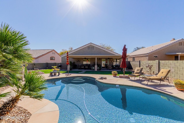 view of swimming pool with a patio area