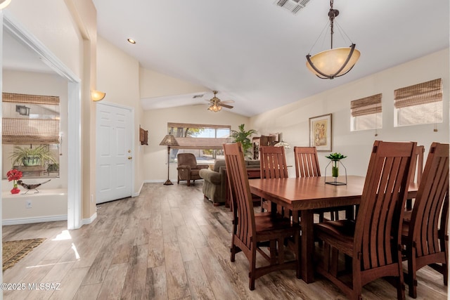 dining area featuring lofted ceiling, ceiling fan, and light hardwood / wood-style floors