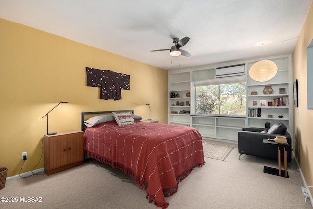 carpeted bedroom featuring ceiling fan and a wall mounted air conditioner