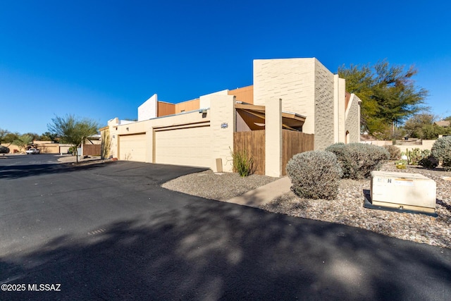 view of side of property with a garage